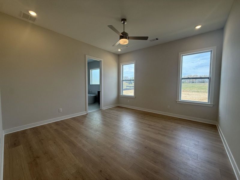 Empty room featuring recessed lighting, dark wood finished floors, and a ceiling fan
