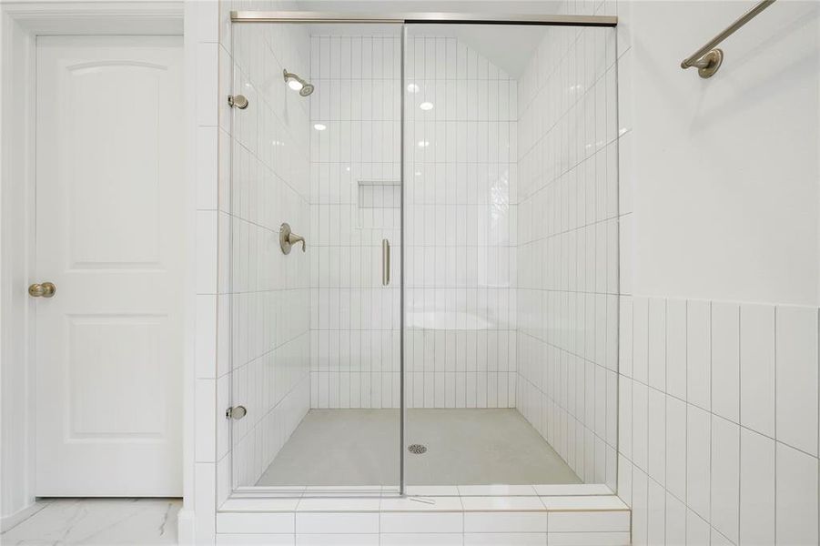 The Walk-In separate shower with Moen Plumbing Fixtures!  (Sample photos of a completed Chesapeake floor plan. The image may feature alternative selections and/or upgrades.