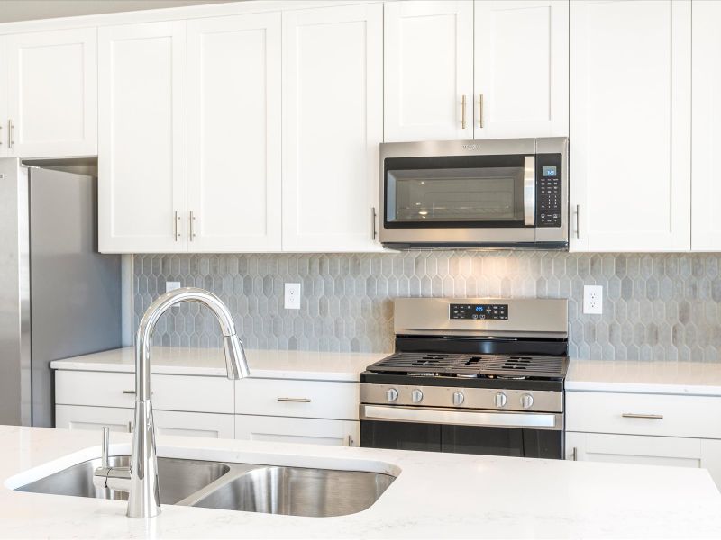 Kitchen in the Wateron floorplan at a Meritage Homes community in Brighton, CO.