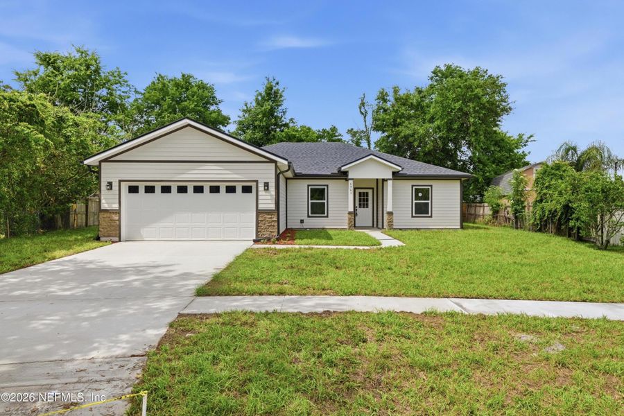 Front exterior of a new home in , Jacksonville, FL, highlighting curb appeal (Image 20).