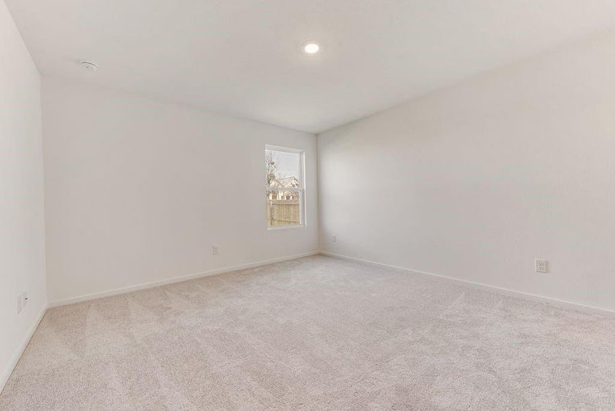 Unfurnished room with recessed lighting, light colored carpet, and baseboards