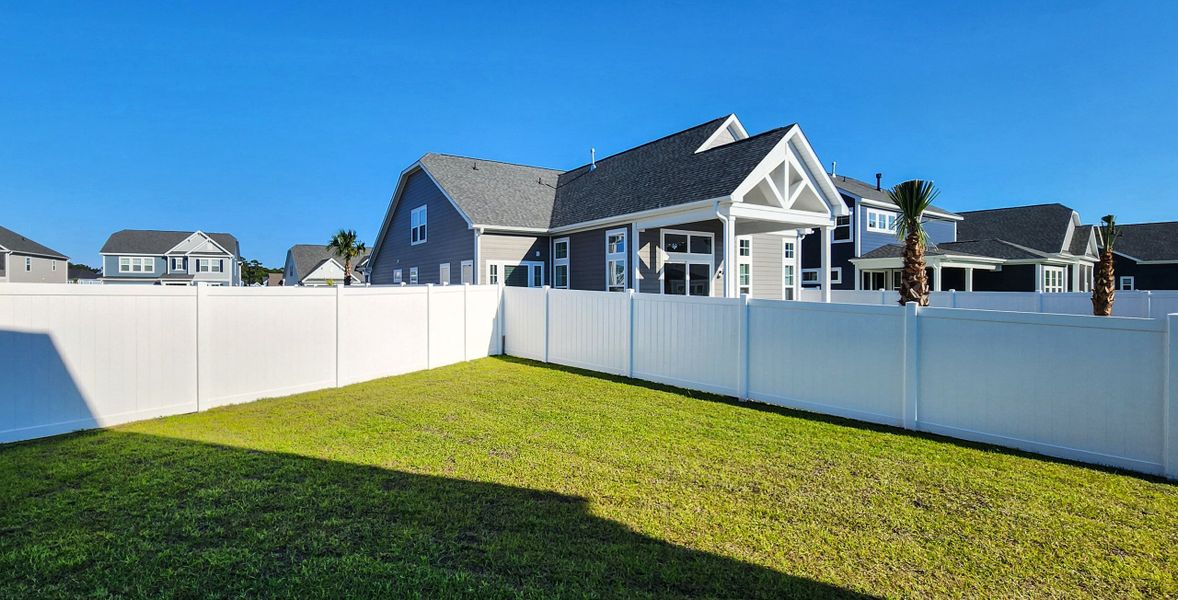 Exterior details and patio area of a home in Waterbridge, Myrtle Beach (Image 16).