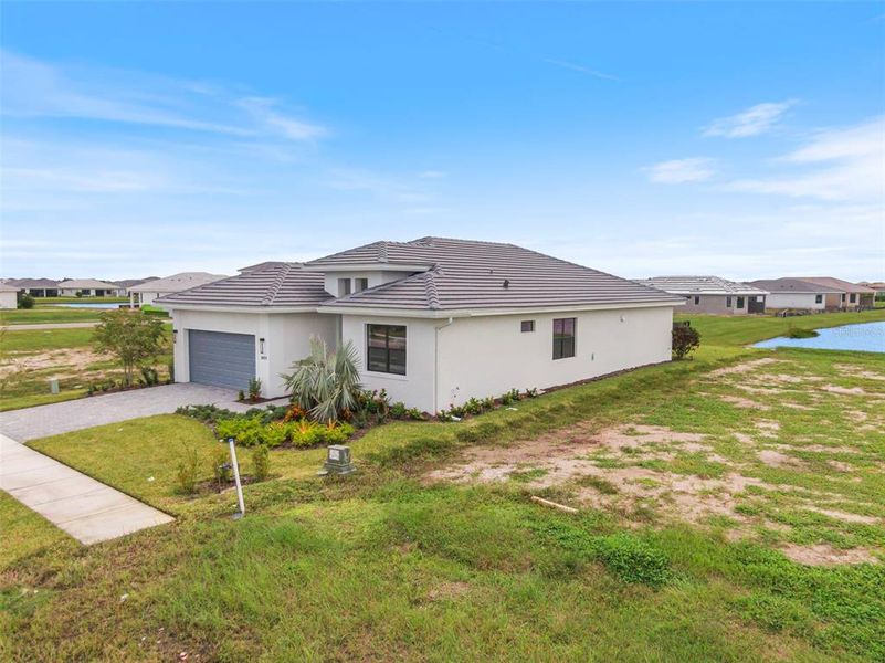 Exterior details and patio area of a home in Cresswind Lakewood Ranch, Lakewood Ranch (Image 4).