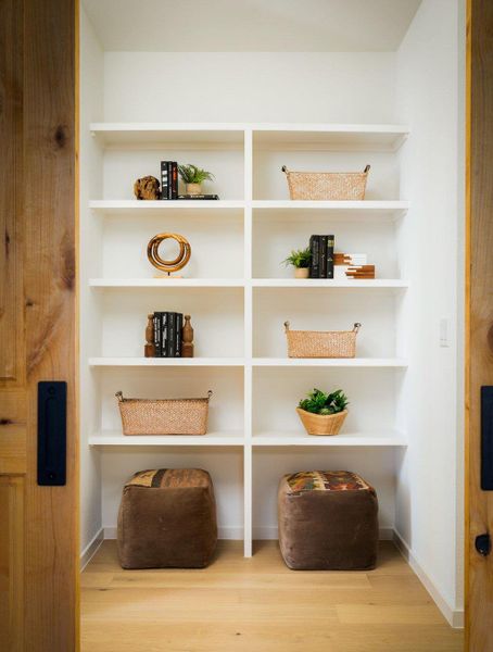 Built-in shelving adds a beautiful design element int he upstairs hall. Built-in shelving adds a beautiful design element int he upstairs hall.