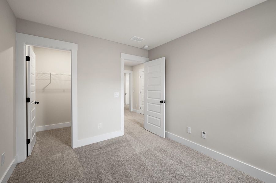 Photo is of a similar home