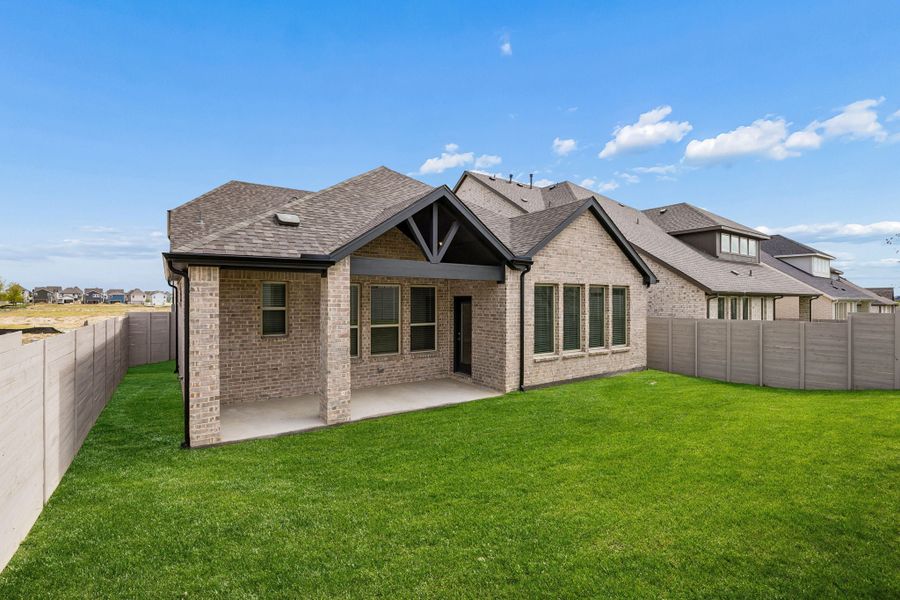 Exterior details and patio area of a home in Painted Tree Woodland West, McKinney (Image 4).