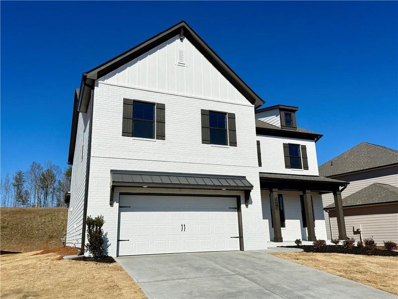 Front exterior of a new home in Ponderosa Farms Manor, Gainesville, GA, highlighting curb appeal (Image 20).