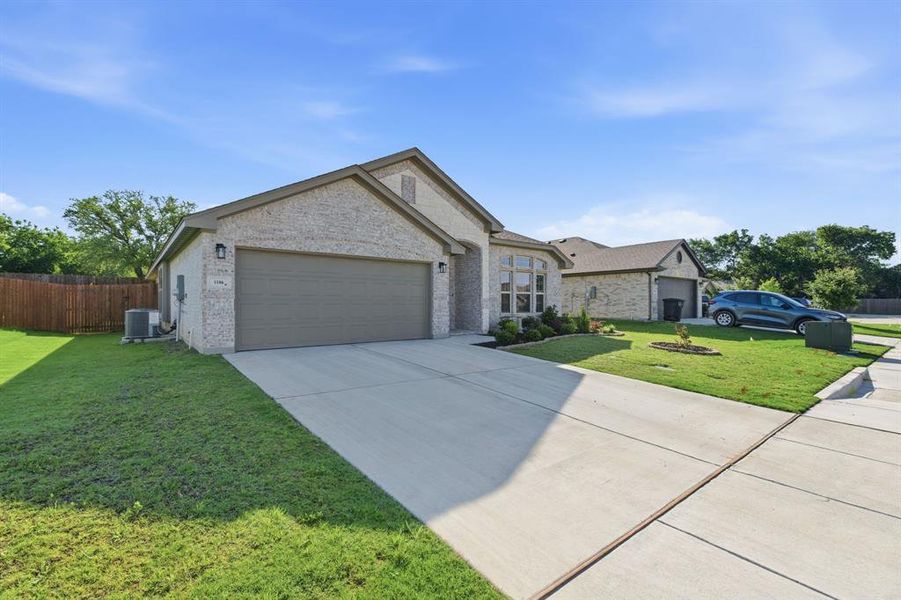 Front exterior of a new home in Trail Creek, Cleburne, TX, highlighting curb appeal (Image 23).