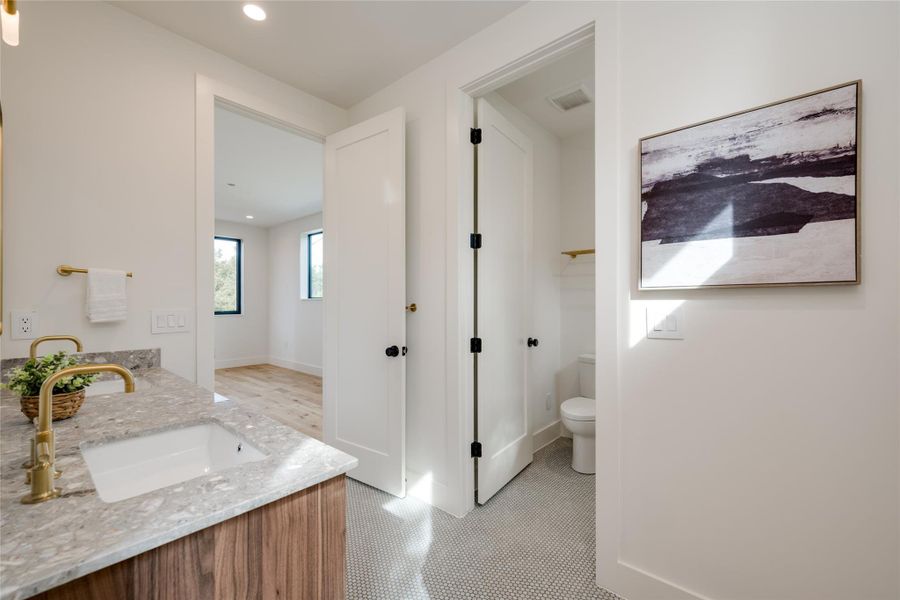 Bathroom with toilet and vanity