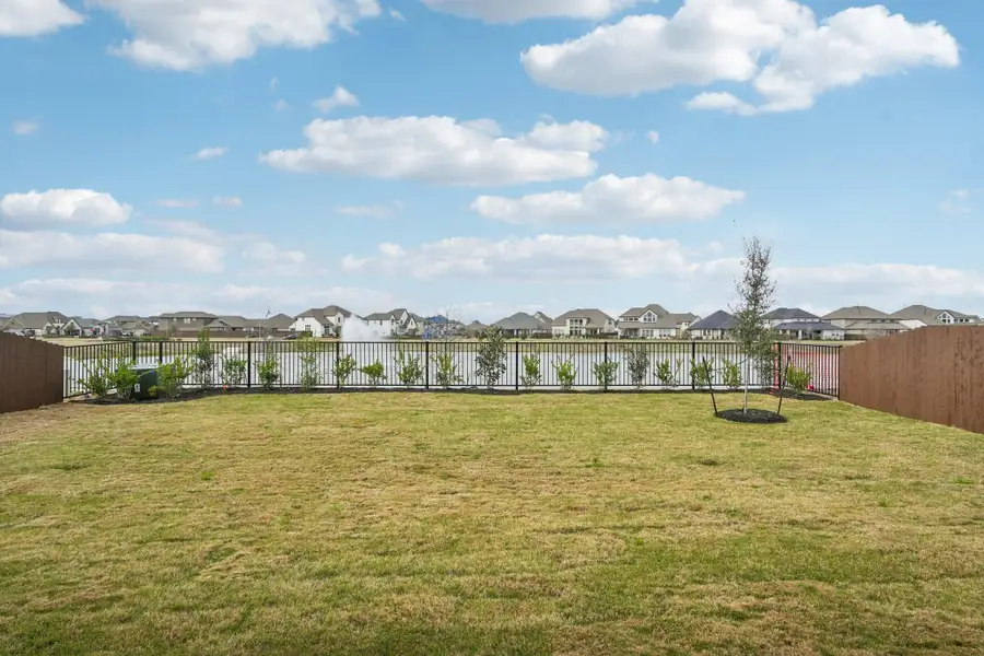 Exterior details and patio area of a home in Del Bello Lakes 60', Manvel (Image 30).