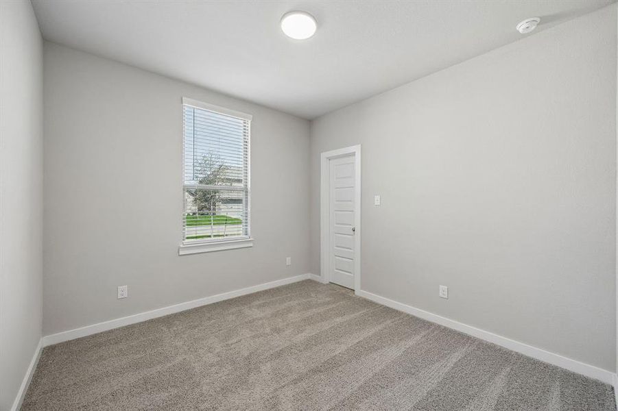 Bedroom in the Emmy II home plan by Trophy Signature Homes - REPRESENTATIVE PHOTO