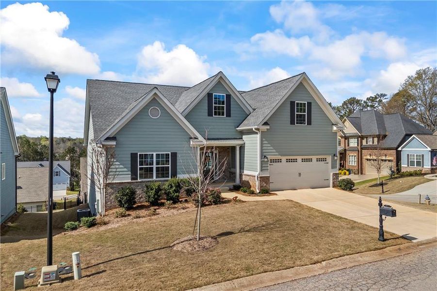 Front exterior of a new home in Traditions of Braselton, Jefferson, GA, highlighting curb appeal (Image 26). Front exterior of a new home in Traditions of Braselton, Jefferson, GA, highlighting curb appeal (Image 26).