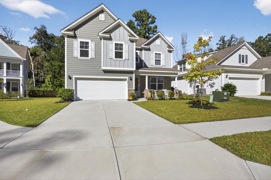 Front exterior of a new home in The Ponds, Summerville, SC, highlighting curb appeal (Image 20).