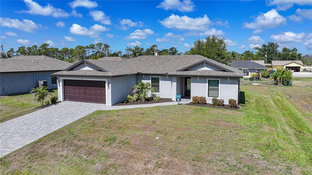 Front exterior of a new home in , Port Charlotte, FL, highlighting curb appeal (Image 26).
