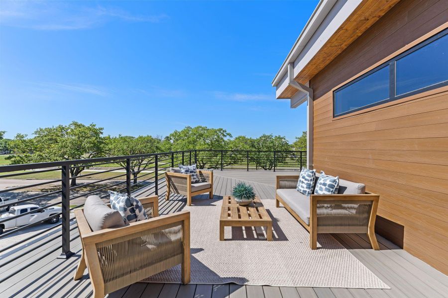 The mature tree canopy visible from the rooftop deck gives the space something no interior room can replicate — a sense of being above it all, surrounded by green, in a neighborhood that looks even better from up here.