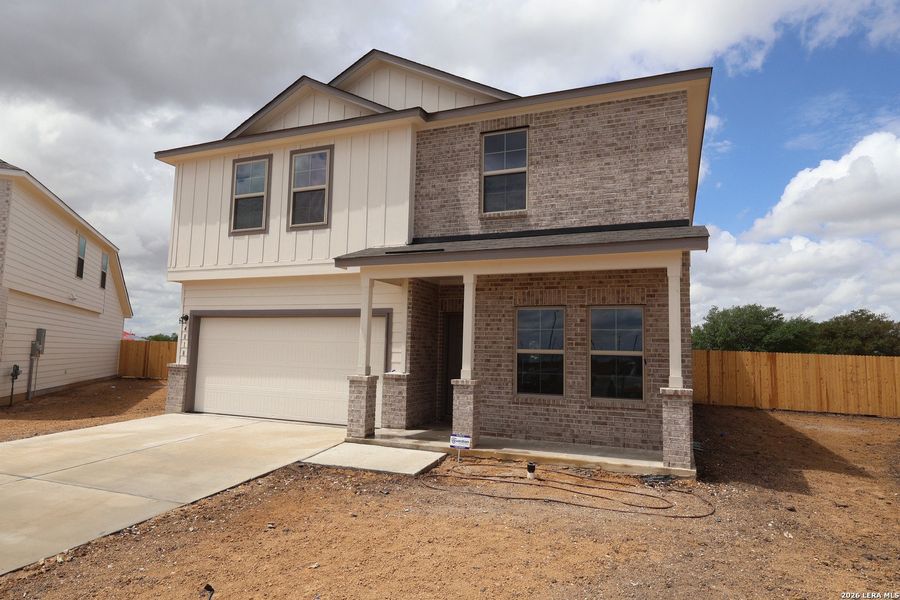 Front exterior of a new home in Verano Farms, Von Ormy, TX, highlighting curb appeal (Image 23).
