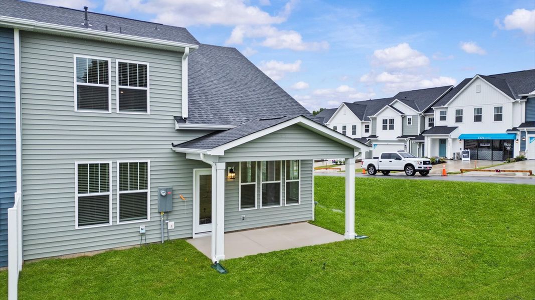 Rear covered porch creates a seamless extension of this home’s elegant design at Silo Ridge by DRB Homes in Anderson, SC