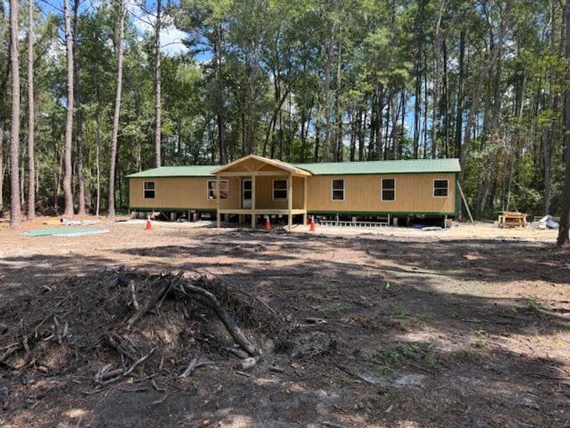 Front exterior of a new home in , Ridgeville, SC, highlighting curb appeal (Image 2).