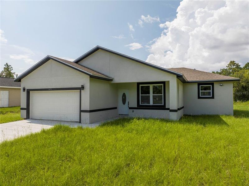 Front exterior of a new home in , Ocala, FL, highlighting curb appeal (Image 20). Front exterior of a new home in , Ocala, FL, highlighting curb appeal (Image 20).