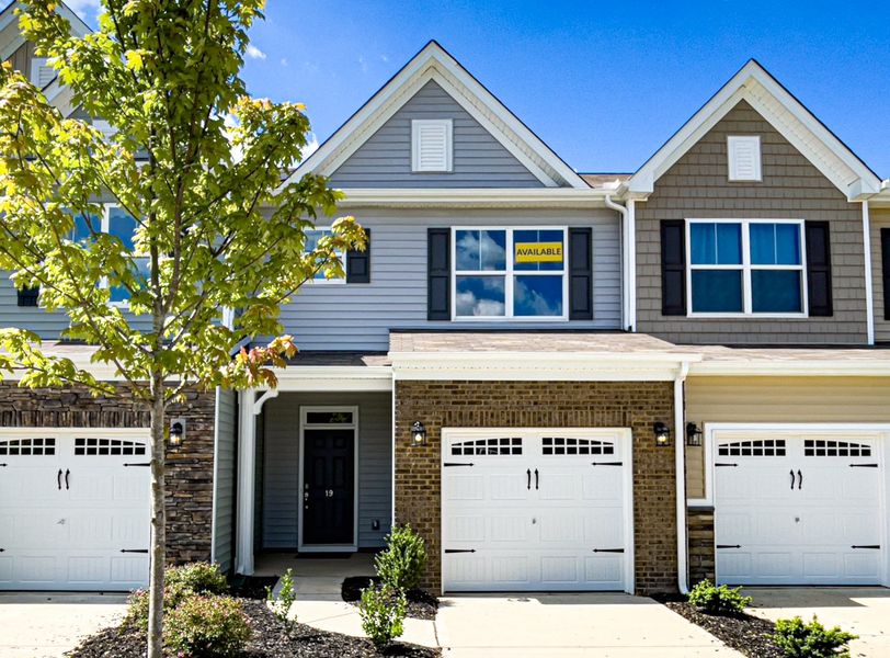 Front exterior of a new home in Fairview Village Townhomes, Simpsonville, SC, highlighting curb appeal (Image 1).
