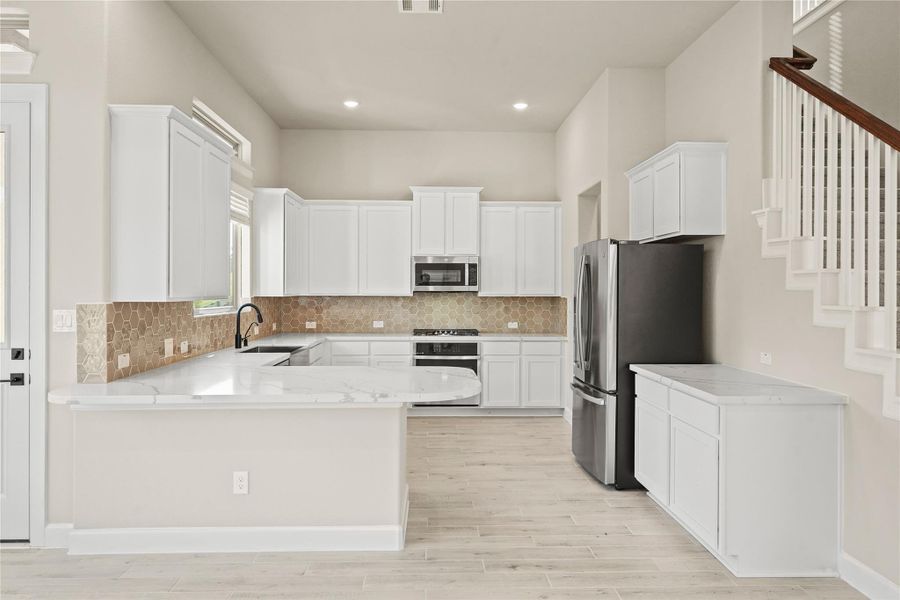 Furnished interior view inside a new home in Waterstone on Lake Conroe, Montgomery (Image 9).