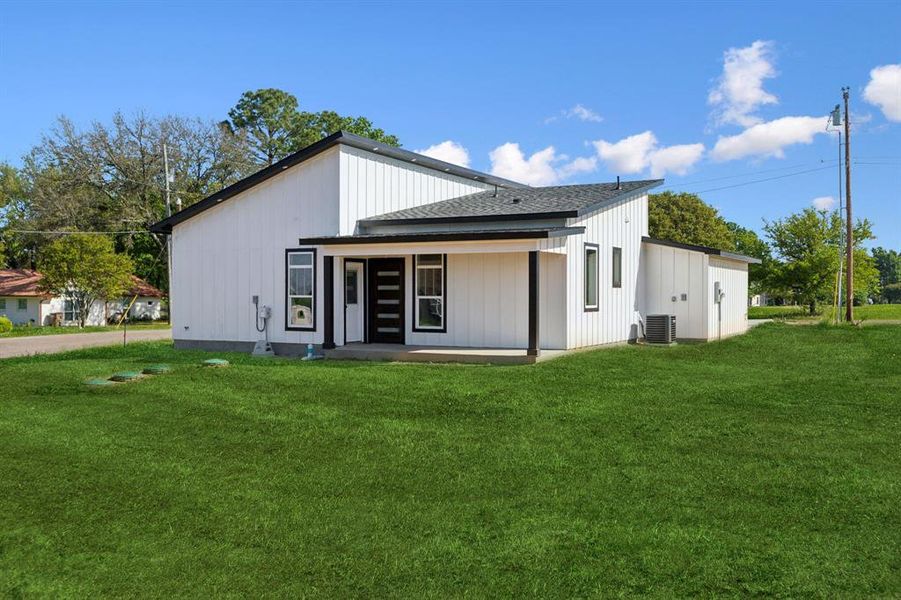 Rear view of house featuring a covered porch Rear view of house featuring a covered porch