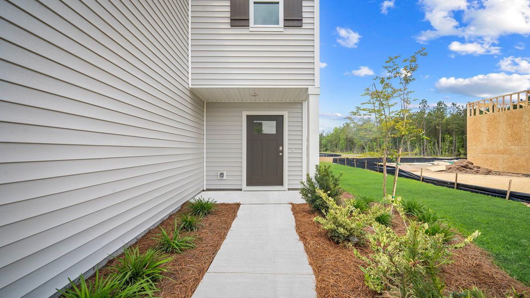 Front exterior of a new home in Longleaf Village, Rincon, GA, highlighting curb appeal (Image 2).