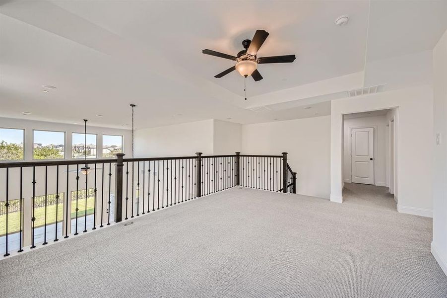 Unfurnished room with carpet and ceiling fan