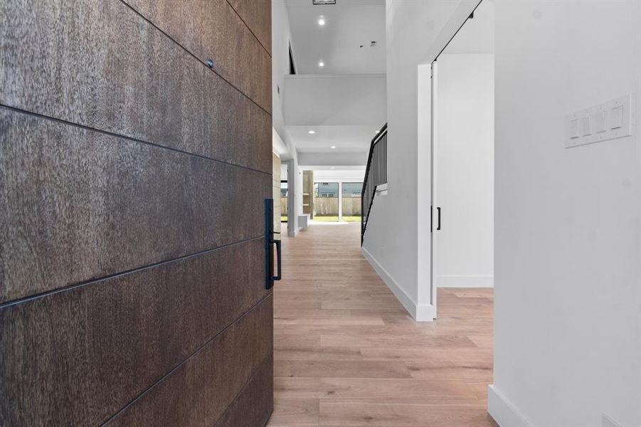 The foyer features high ceilings, a neutral color flooring in all the house.  This home offers 2 bedrooms in the first floor , a study and an open concept living.