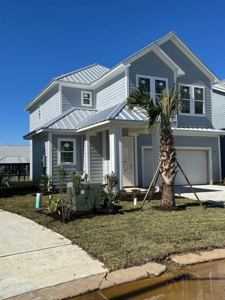 Front exterior of a new home in Grand Cay Harbour, Texas City, TX, highlighting curb appeal (Image 1). Front exterior of a new home in Grand Cay Harbour, Texas City, TX, highlighting curb appeal (Image 1).