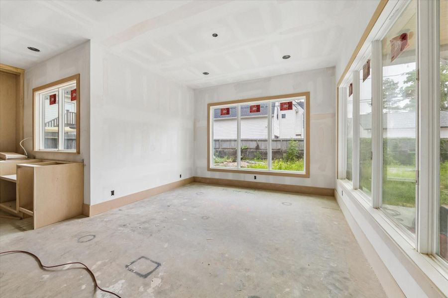 KITCHEN / DINING ROOM - Kitchen looking towarsd the dining room and living room. Kitchen offers a large island, stainless appliances and scullery. -- **Current construction as of 4/6/2026** KITCHEN / DINING ROOM - Kitchen looking towarsd the dining room and living room. Kitchen offers a large island, stainless appliances and scullery. -- **Current construction as of 4/6/2026**