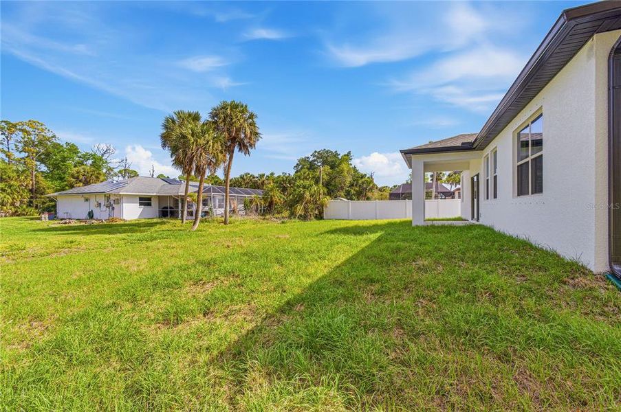 Exterior details and patio area of a home in , North Port (Image 29).