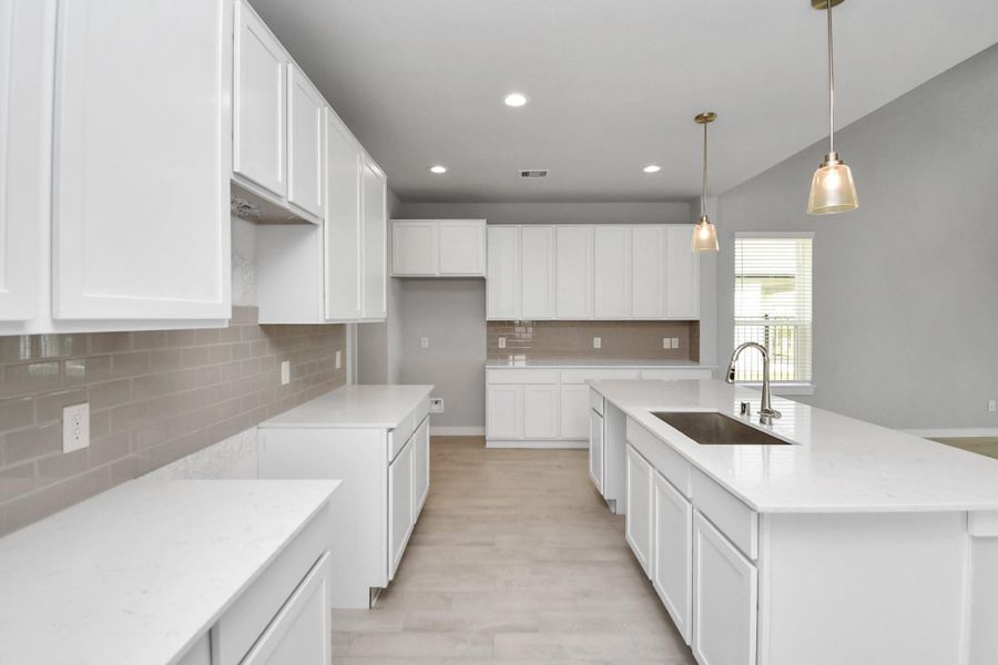This generously spacious kitchen is a dream realized! Sample photo of completed home with similar floor plan. Actual colors and selections may vary. This generously spacious kitchen is a dream realized! Sample photo of completed home with similar floor plan. Actual colors and selections may vary.