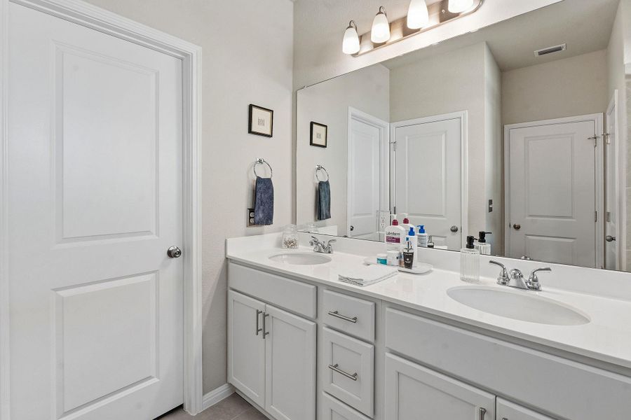 Bathroom featuring double vanity Bathroom featuring double vanity