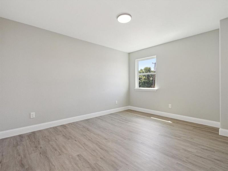 Spare room featuring light wood-type flooring