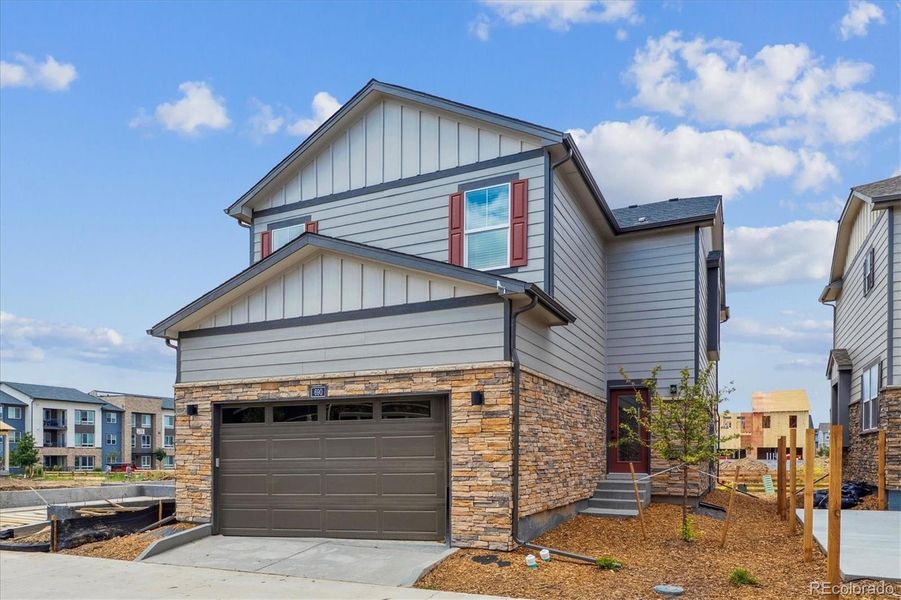 Front exterior of a new home in Horizon Uptown, Aurora, CO, highlighting curb appeal (Image 20).