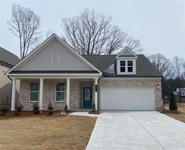 Front exterior of a new home in River Oaks, Locust Grove, GA, highlighting curb appeal (Image 1). Front exterior of a new home in River Oaks, Locust Grove, GA, highlighting curb appeal (Image 1).