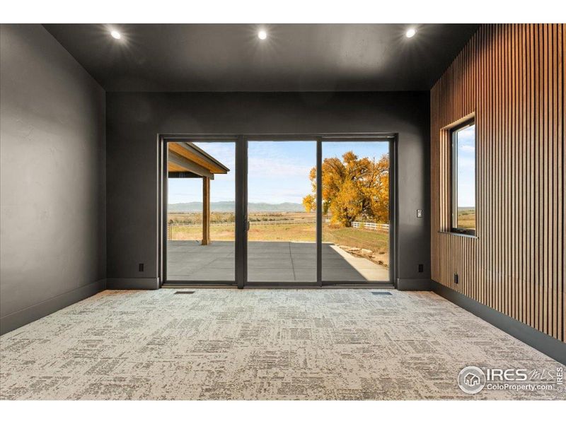 Views of mountains from primary bedroom and slinding doors out to patio