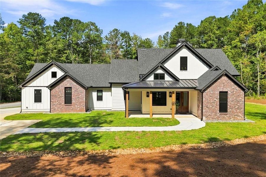 Front exterior of a new home in , Canton, GA, highlighting curb appeal (Image 27).
