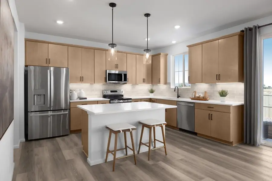 Furnished interior in a model home at The Nest Reserve at Canyon Creek in Erie (Image 21).