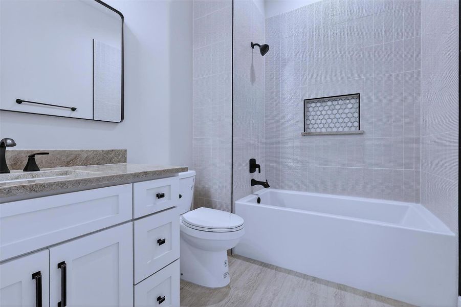 Private ensuite bathroom! High-end finishes elevate everyday functionality.