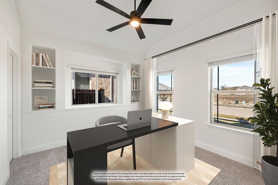 Home office with dark desk, built-in shelves, ceiling fan, and multiple windows with natural light Home office with dark desk, built-in shelves, ceiling fan, and multiple windows with natural light