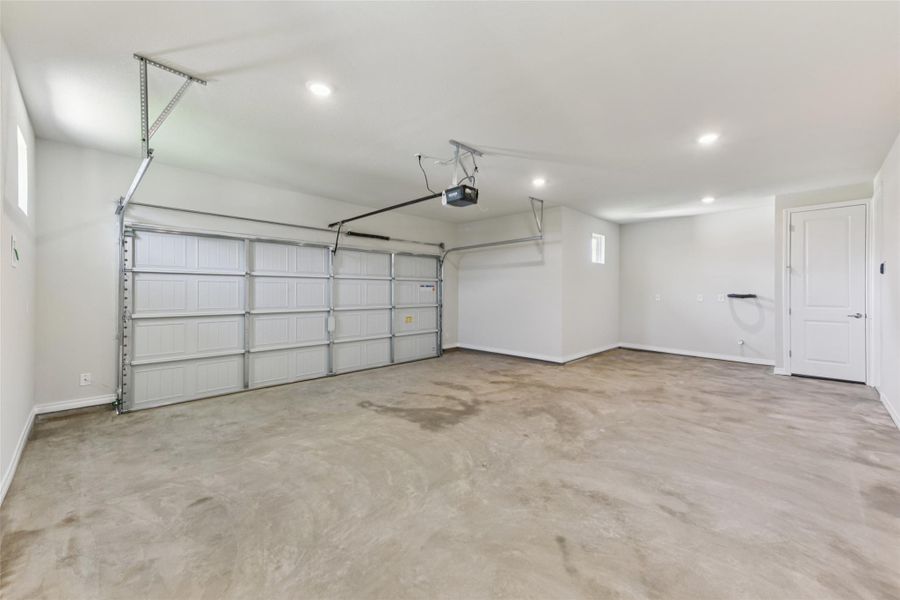 Garage with recessed lighting and a garage door opener Garage with recessed lighting and a garage door opener