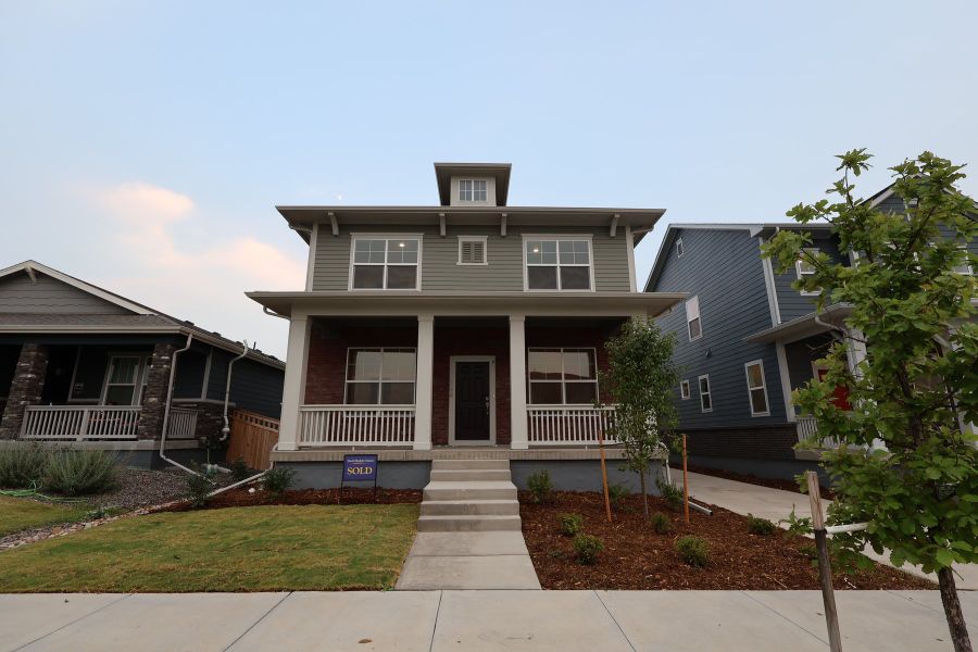 Front exterior of a new home in Painted Prairie Cottage Collection, Aurora, CO, highlighting curb appeal (Image 2).