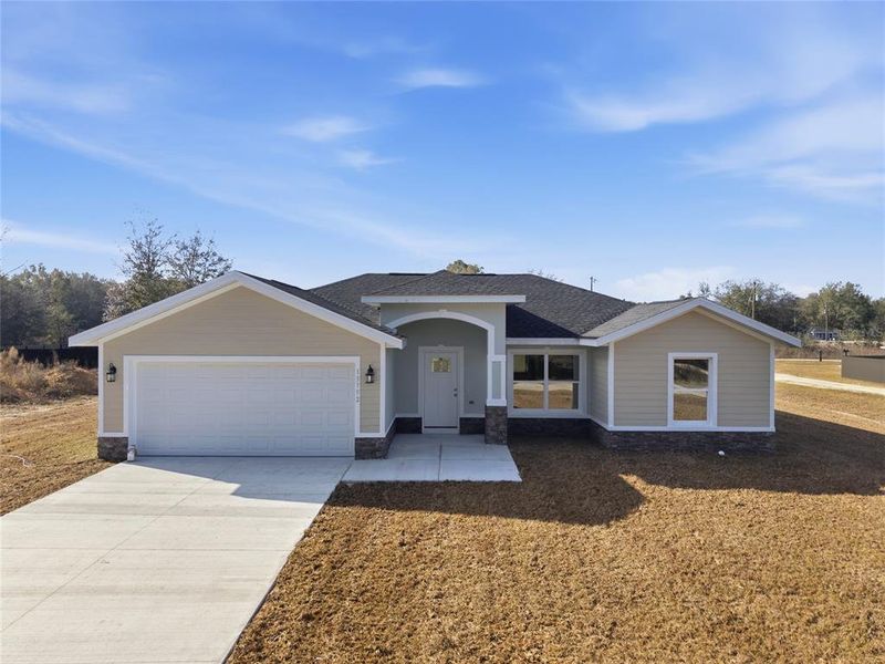 Front exterior of a new home in , Dunnellon, FL, highlighting curb appeal (Image 18).