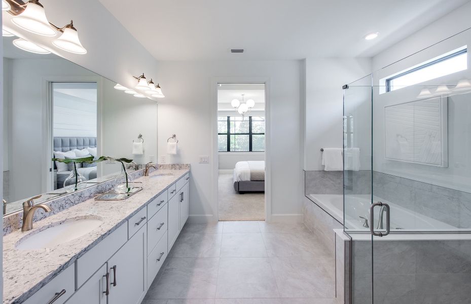 Owner's bathroom with dual sinks and optional garden tub