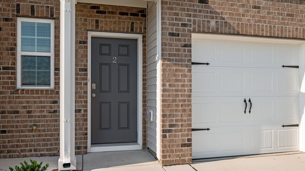 Exterior details and patio area of a home in The Townes at Ridgewood Farms, Winterville (Image 17).