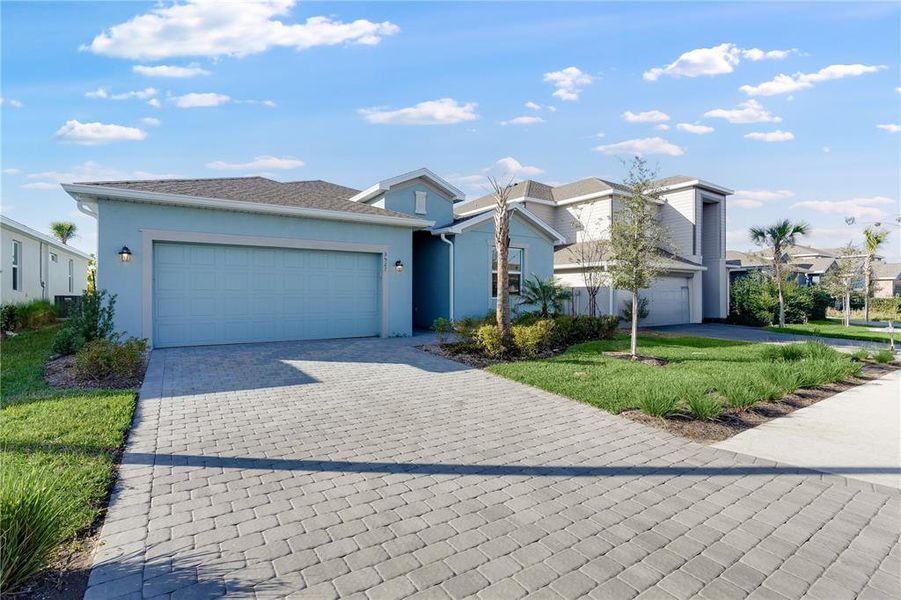 Front exterior of a new home in Rye Ranch, Parrish, FL, highlighting curb appeal (Image 1). Front exterior of a new home in Rye Ranch, Parrish, FL, highlighting curb appeal (Image 1).