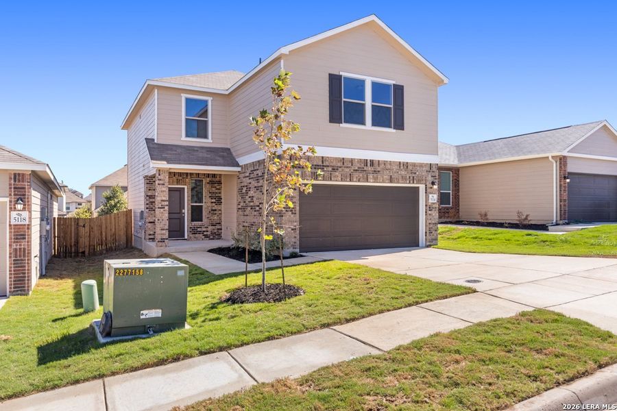 Front exterior of a new home in Knox Ridge, Converse, TX, highlighting curb appeal (Image 20).