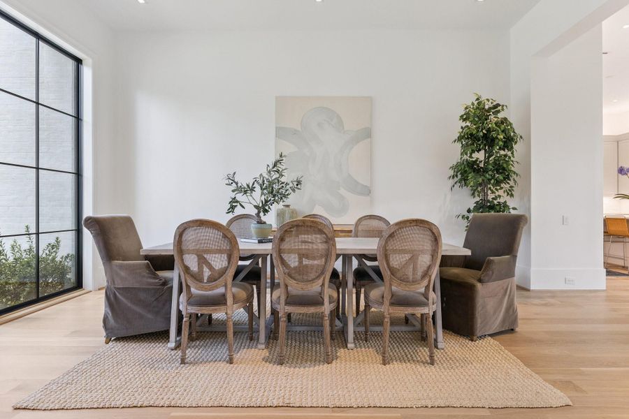 [Dining Room]An alternate view of the dining room reveals the open transition to the gathering kitchen.